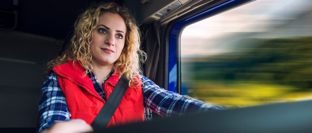 Image of a woman driving a HGV.