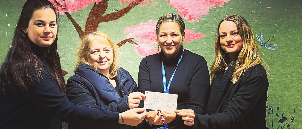 Image of Pure Staff donating to Square Peg Activities.