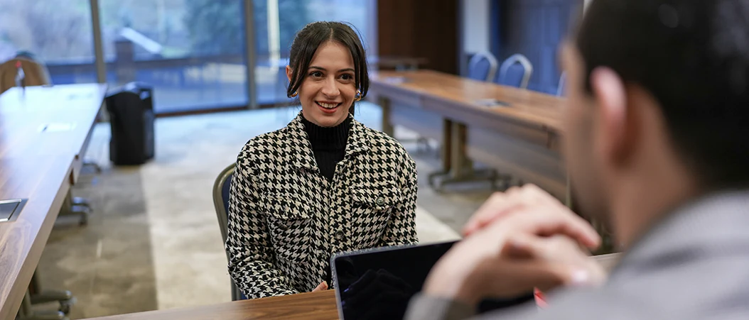 A blog banner image of two people in an interview.