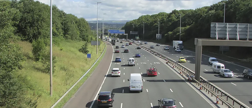 Image of vehicles driving down a UK motorway.